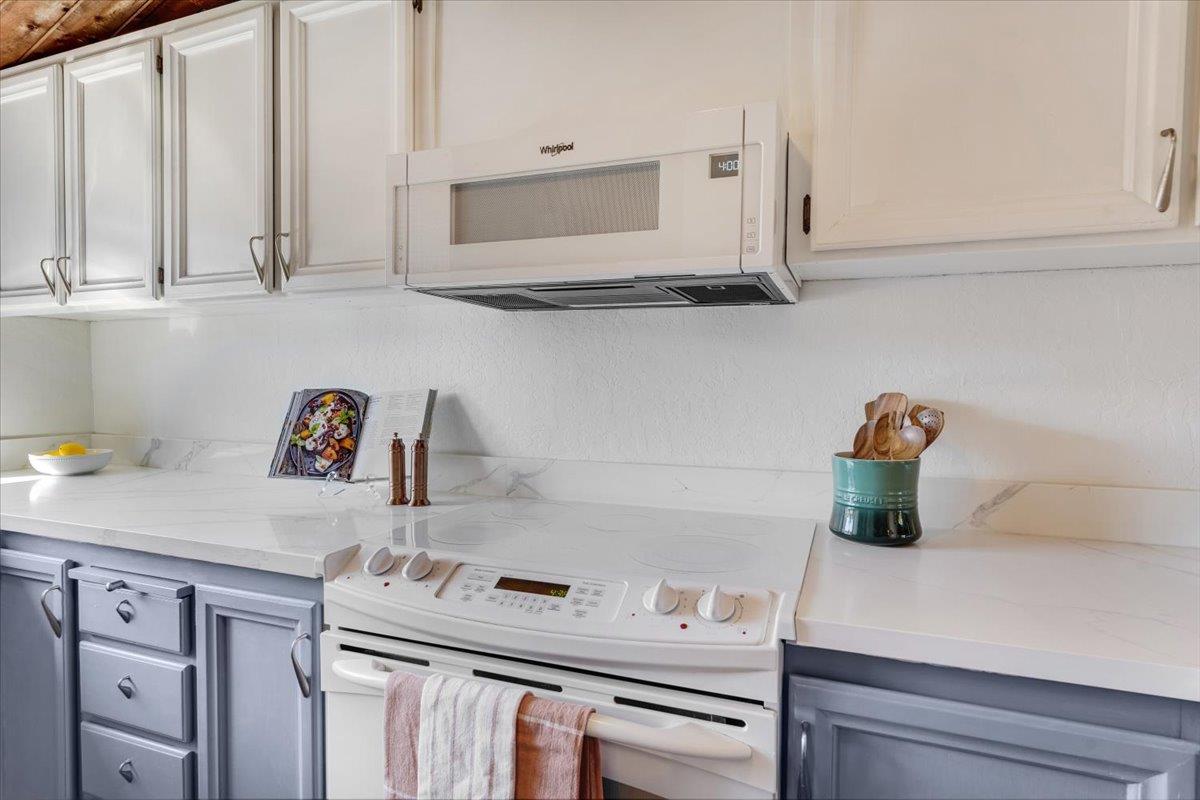 113 Tree Frog Lane Santa Cruz, CA 95060 - Photo 9 of 49 a kitchen with white cabinets and a stove