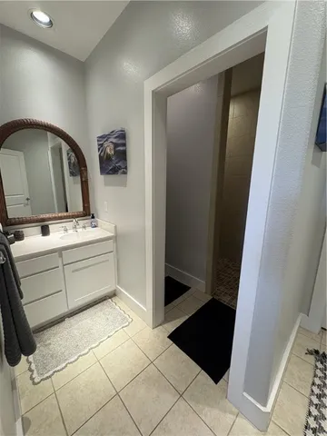 a white toilet sitting next to a small bathroom