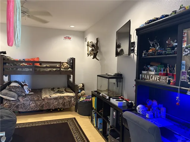 a bedroom with a bed and a mirror