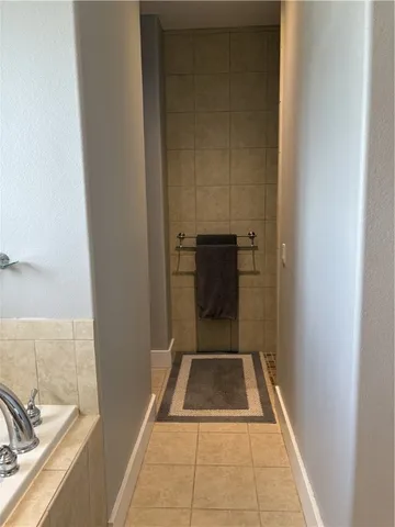 a front view of a house with a garden and porch