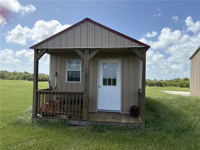 a view of a lake with houses in the back