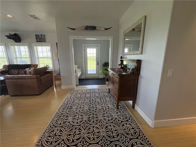 a living room with furniture and a rug