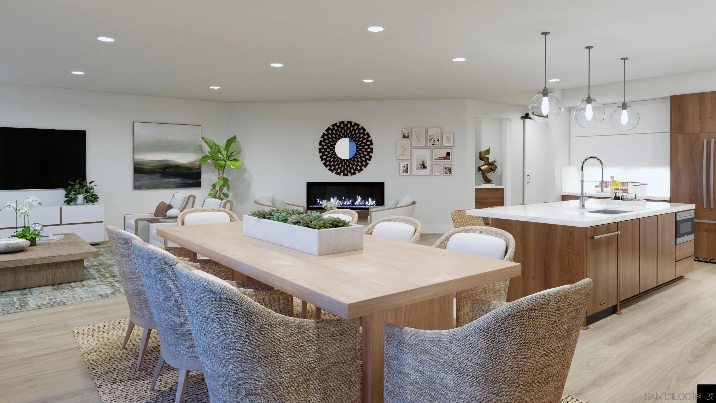 2501 State Street, Unit 404 Carlsbad, CA 92008 - Photo 8 of 18 a large kitchen with a table chairs and a flat screen tv