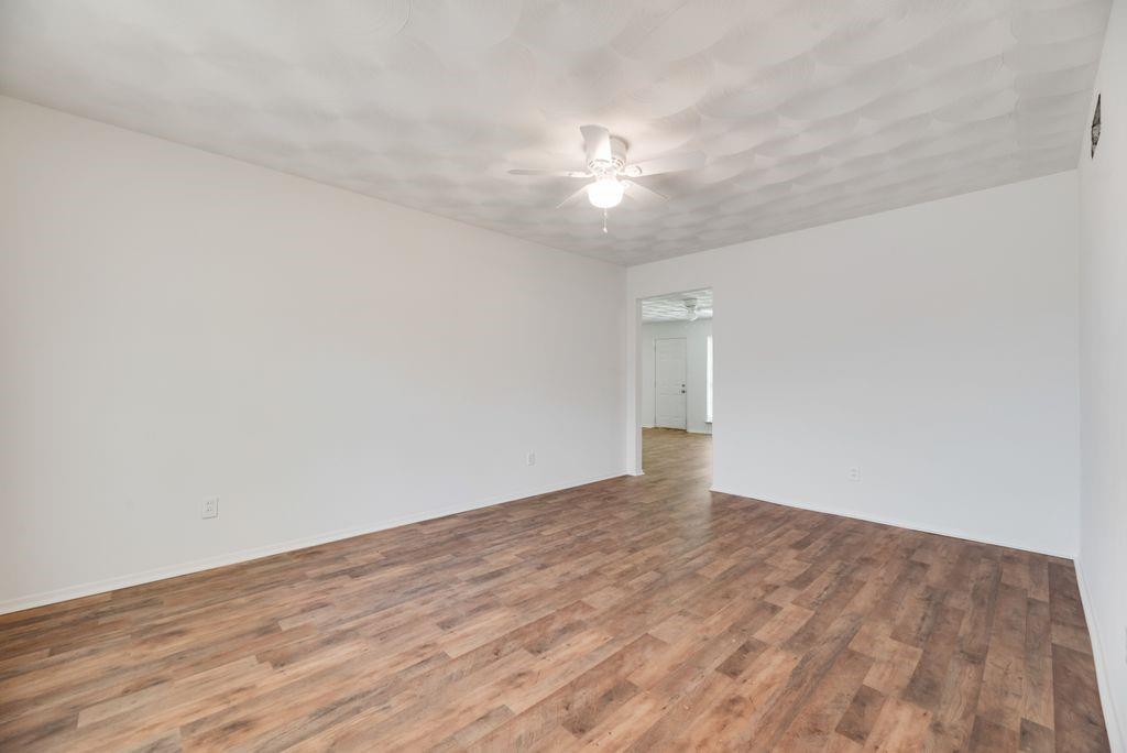 311 Azalea Lane Duncanville, TX 75137 - Photo 9 of 21 wooden floor in an empty room