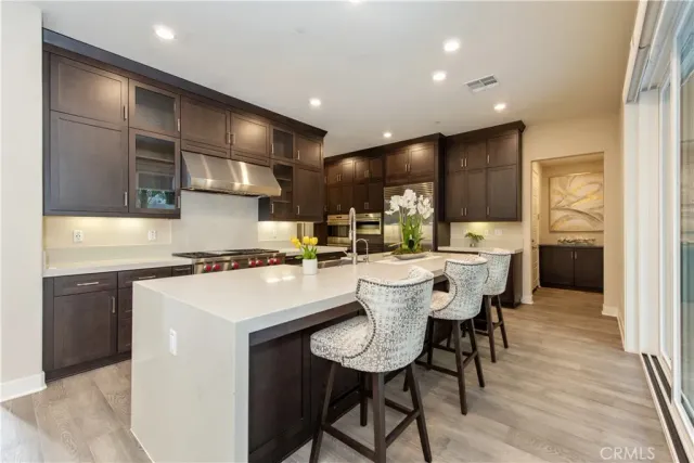 a kitchen with a table and chairs in it