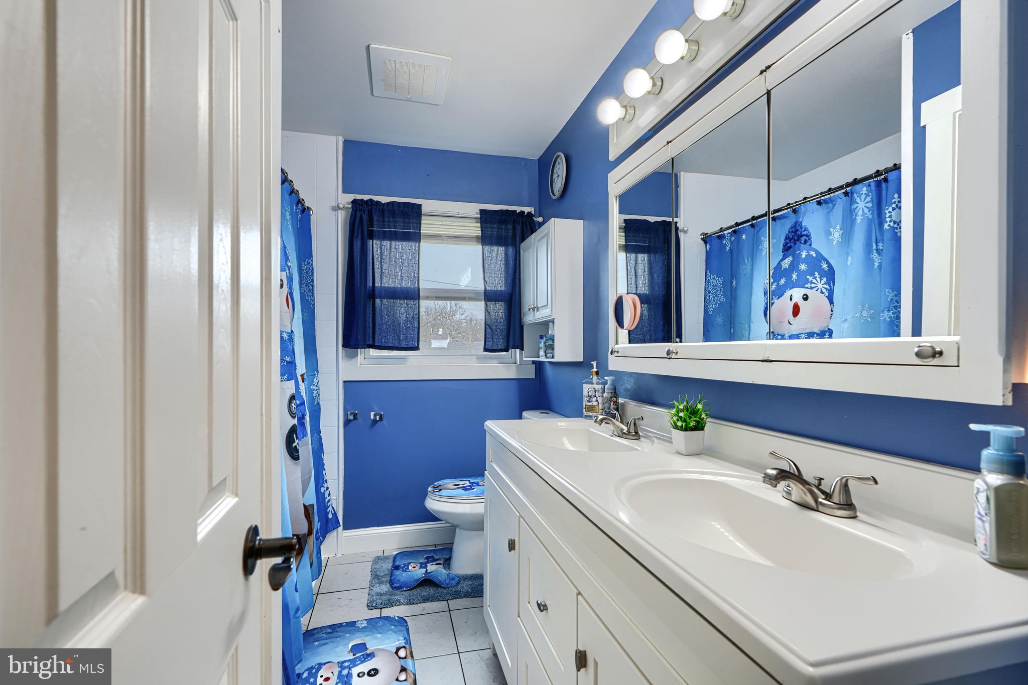 1500 South Tollgate Road Bel Air, MD 21015 - Photo 12 of 30 a bathroom with a sink toilet and mirror