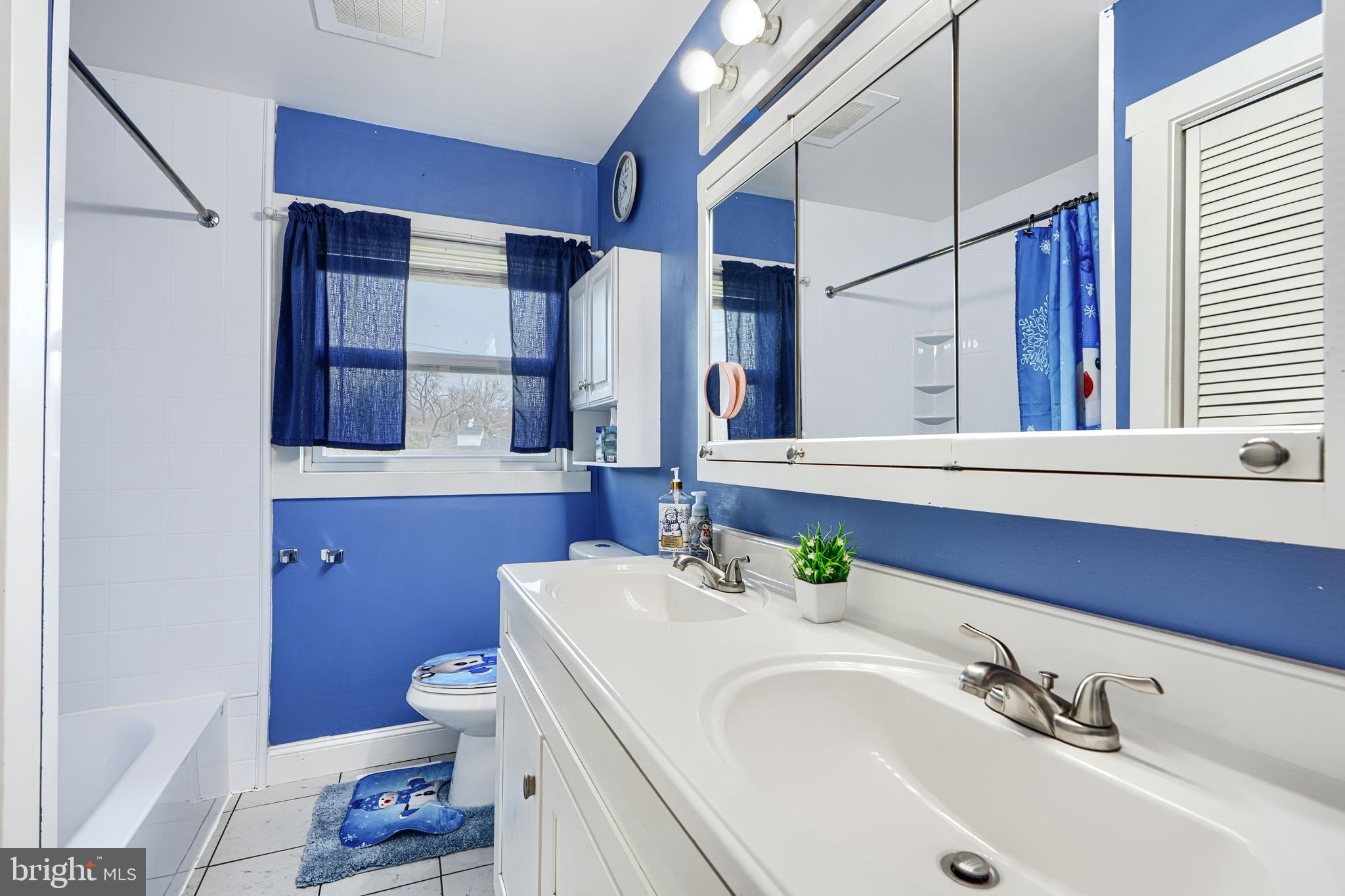 1500 South Tollgate Road Bel Air, MD 21015 - Photo 13 of 30 a bathroom with a sink toilet and mirror