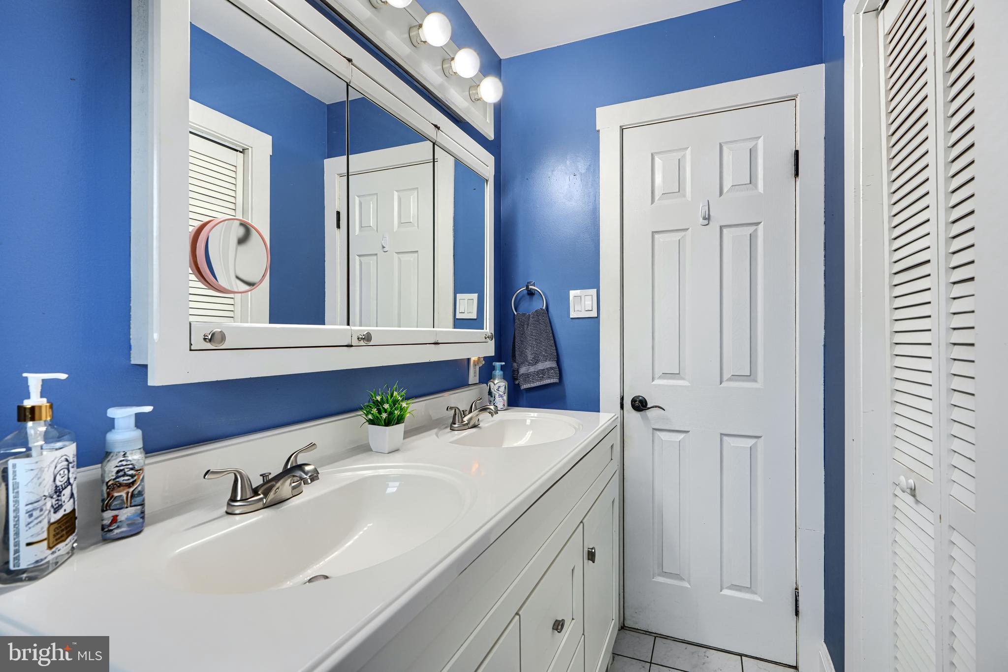 1500 South Tollgate Road Bel Air, MD 21015 - Photo 14 of 30 a bathroom with a sink vanity and a mirror
