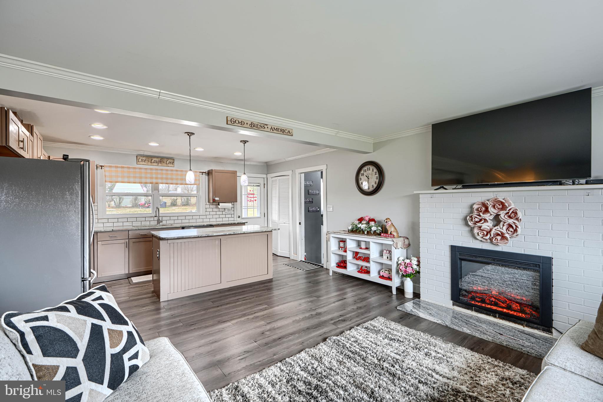 1500 South Tollgate Road Bel Air, MD 21015 - Photo 4 of 30 a living room with furniture a flat screen tv and a fireplace
