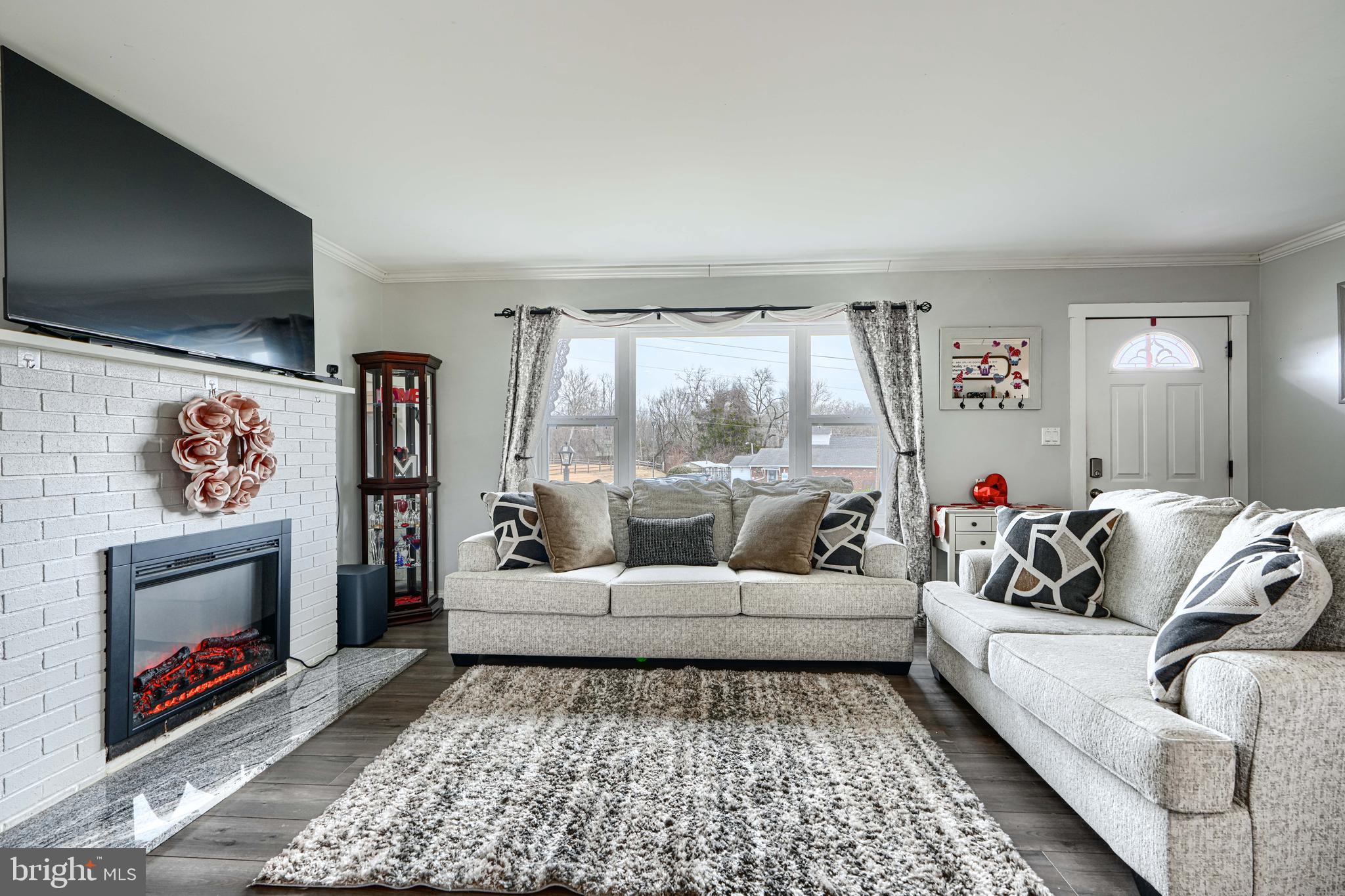 1500 South Tollgate Road Bel Air, MD 21015 - Photo 5 of 30 a living room with furniture and a fireplace