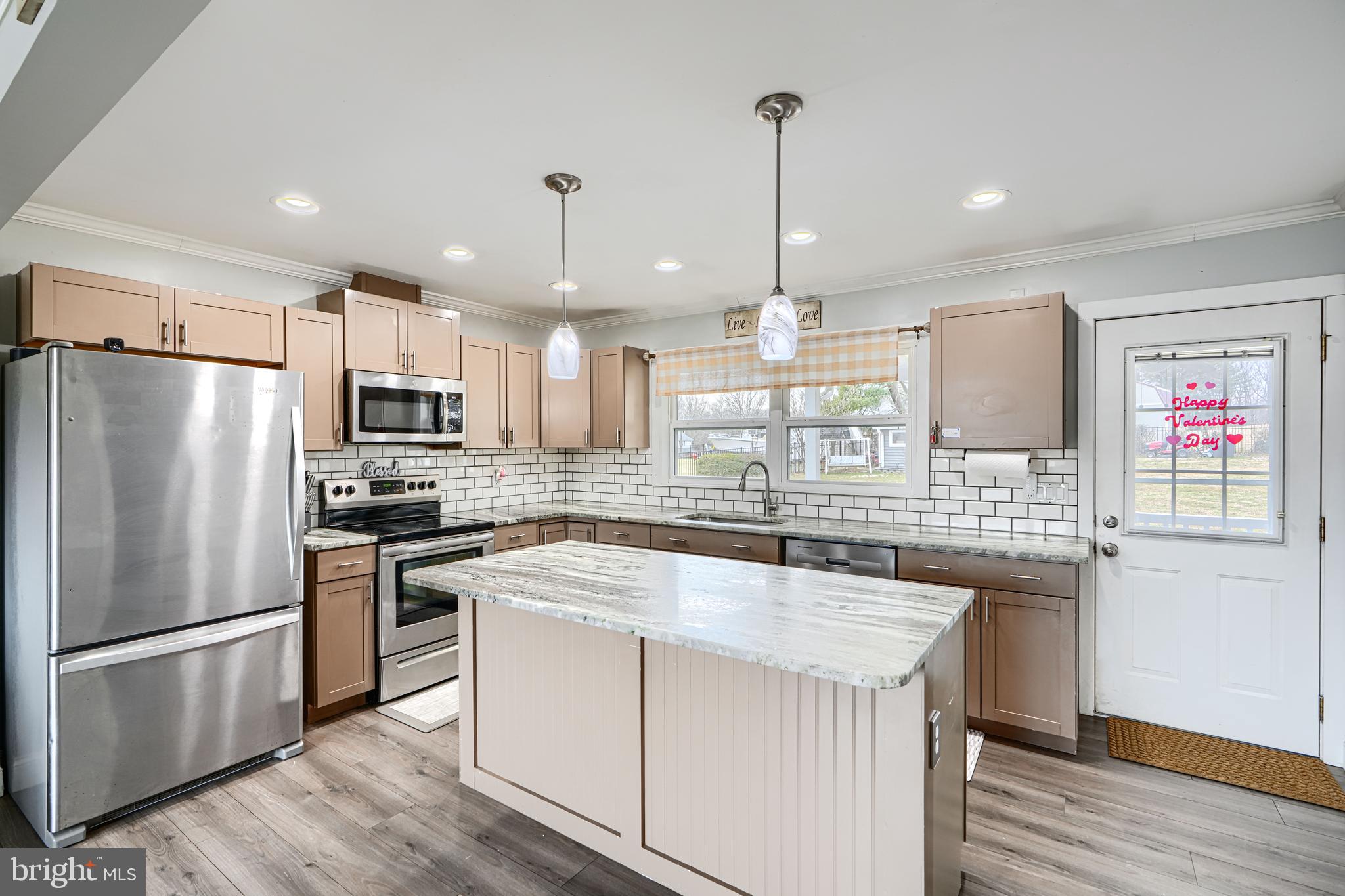 1500 South Tollgate Road Bel Air, MD 21015 - Photo 7 of 30 a kitchen with kitchen island a sink stainless steel appliances and refrigerator