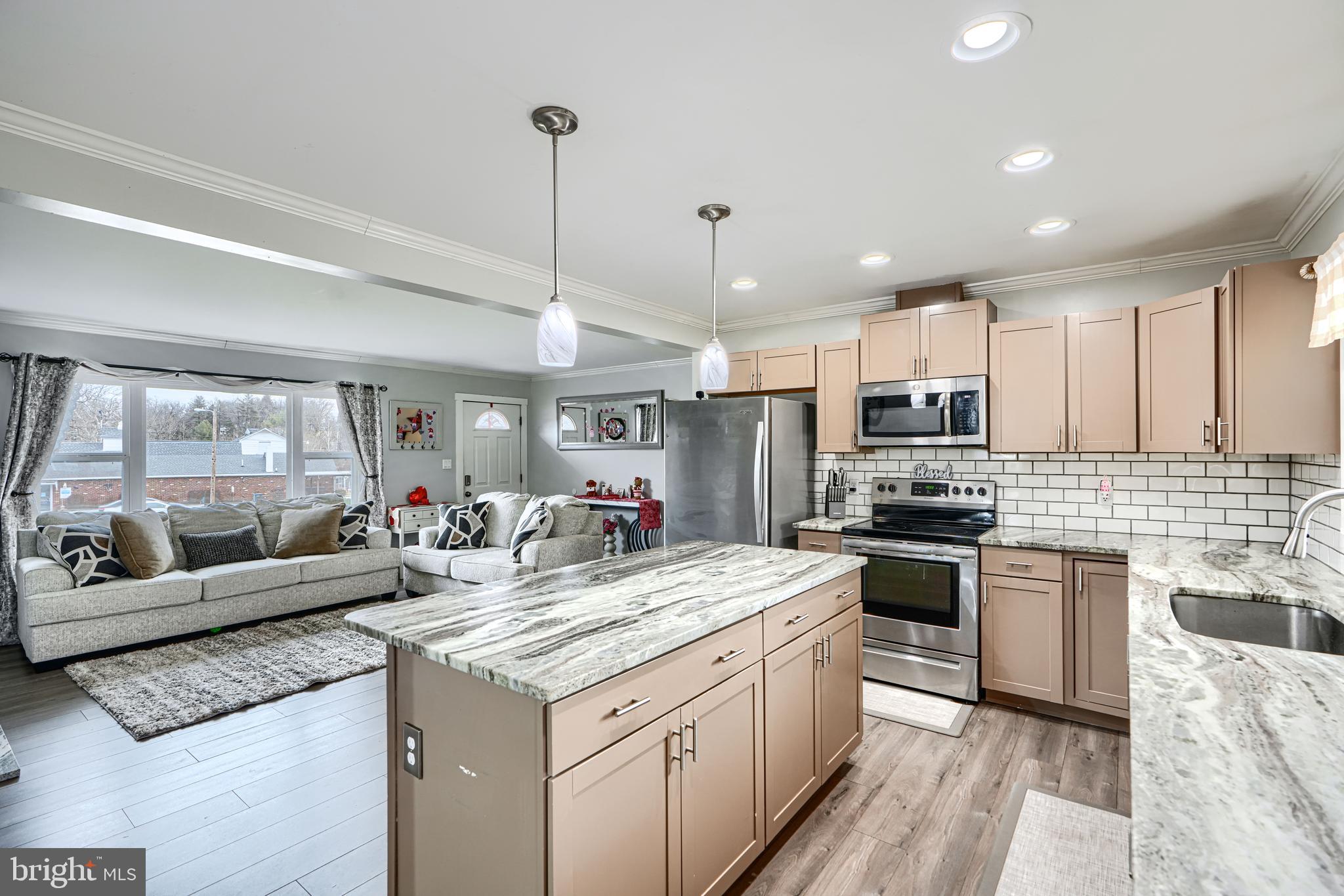 1500 South Tollgate Road Bel Air, MD 21015 - Photo 8 of 30 a kitchen with granite countertop stainless steel appliances a sink a stove top oven a counter space and cabinets