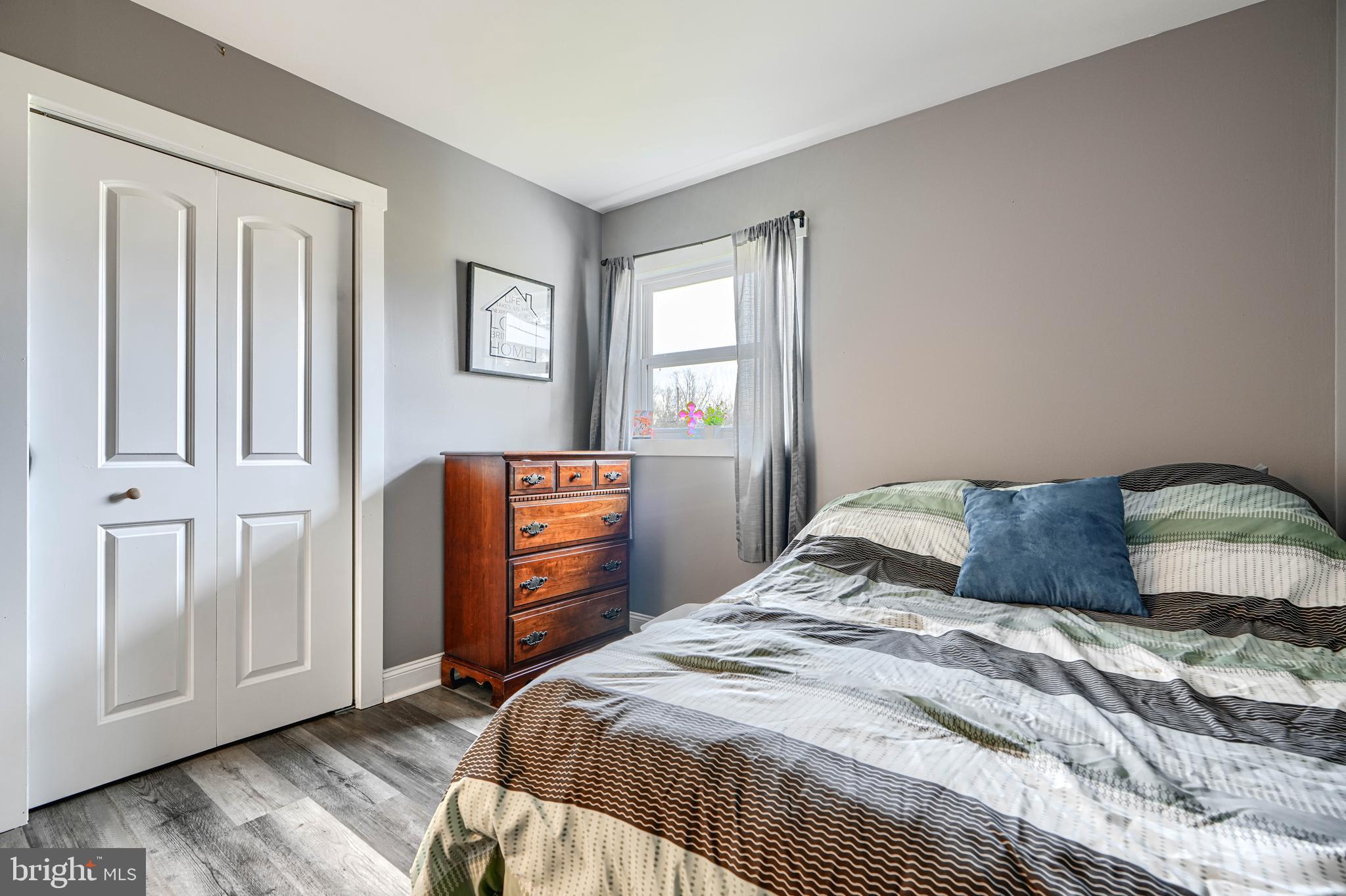 1500 South Tollgate Road Bel Air, MD 21015 - Photo 9 of 30 a bedroom with a bed and wooden floor