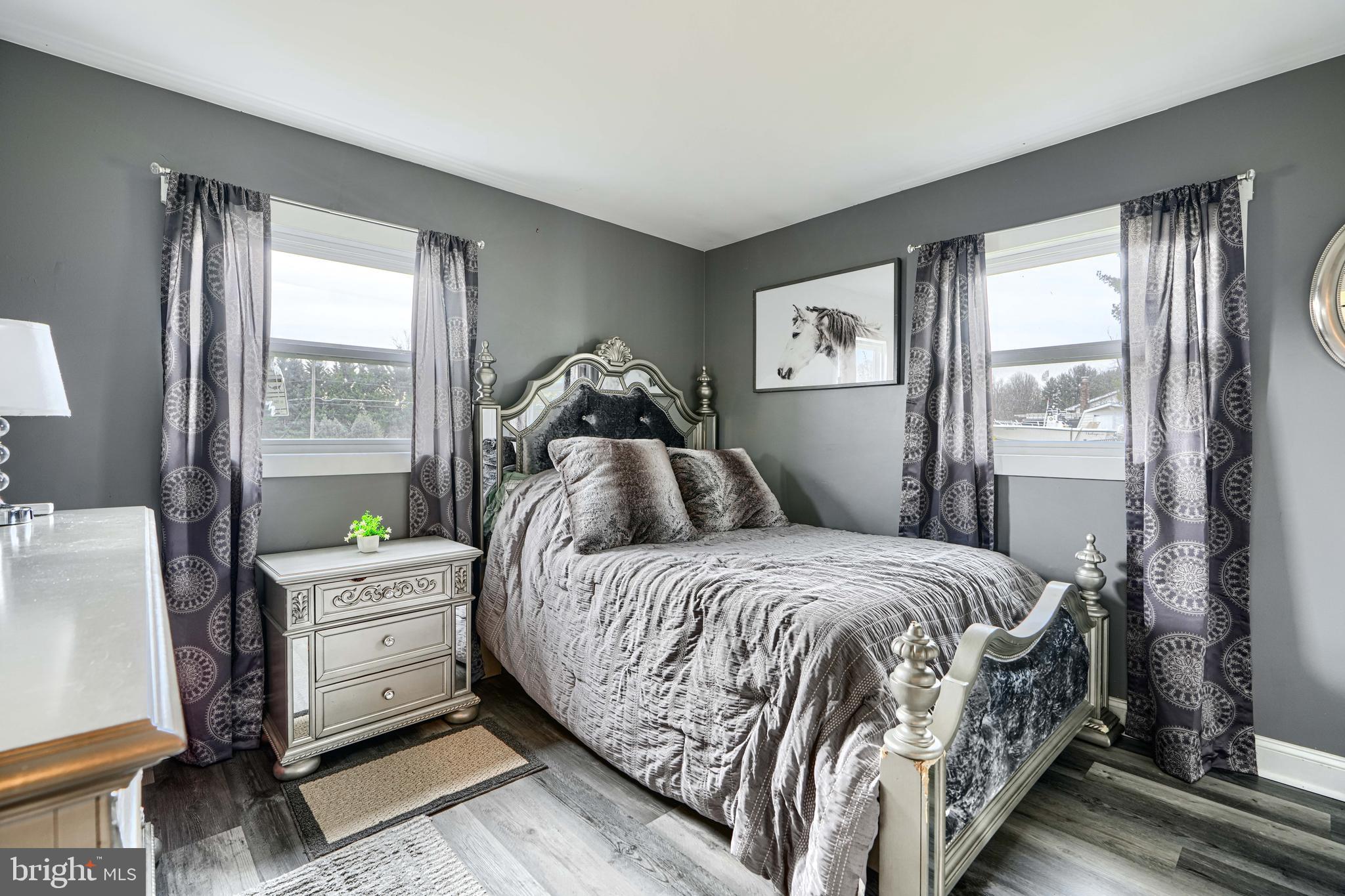 1500 South Tollgate Road Bel Air, MD 21015 - Photo 10 of 30 a bedroom with a bed and large windows