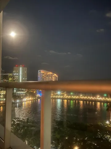 a living room with furniture and large windows
