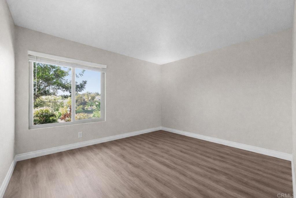 510 Bluffview Road Spring Valley, CA 91977 - Photo 15 of 19 wooden floor in an empty room with a window