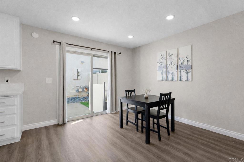 510 Bluffview Road Spring Valley, CA 91977 - Photo 6 of 19 a view of a dining room with furniture and wooden floor
