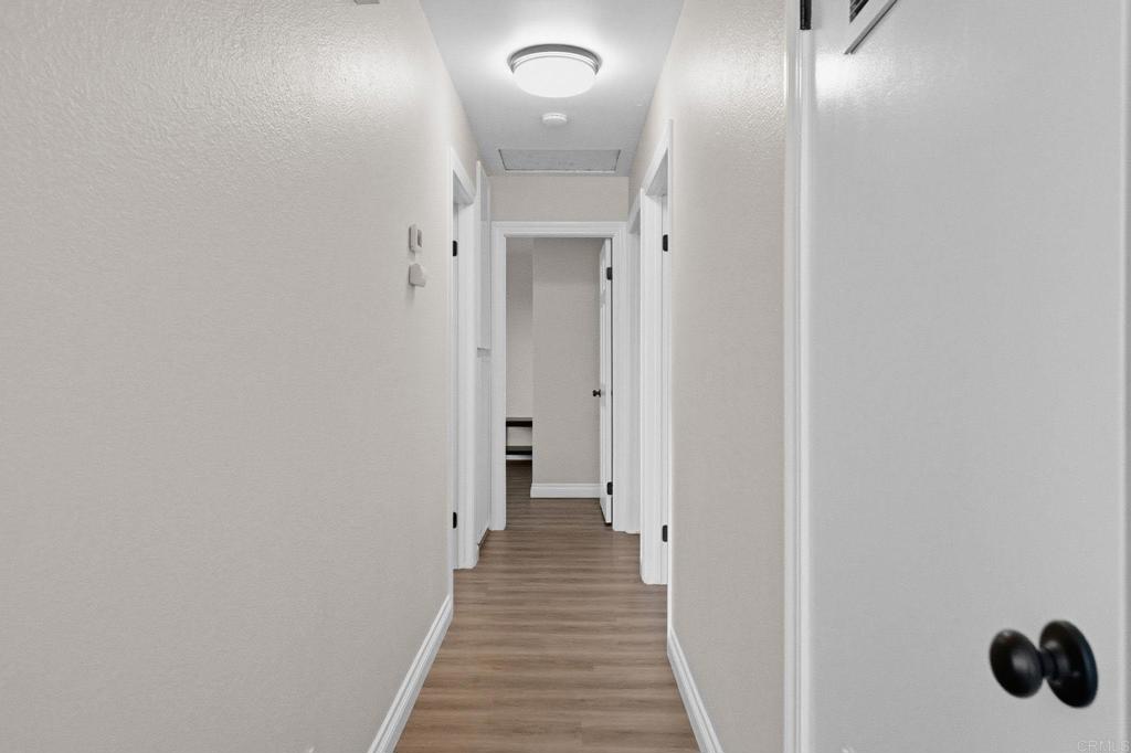 510 Bluffview Road Spring Valley, CA 91977 - Photo 10 of 19 a view of a hallway with wooden floor