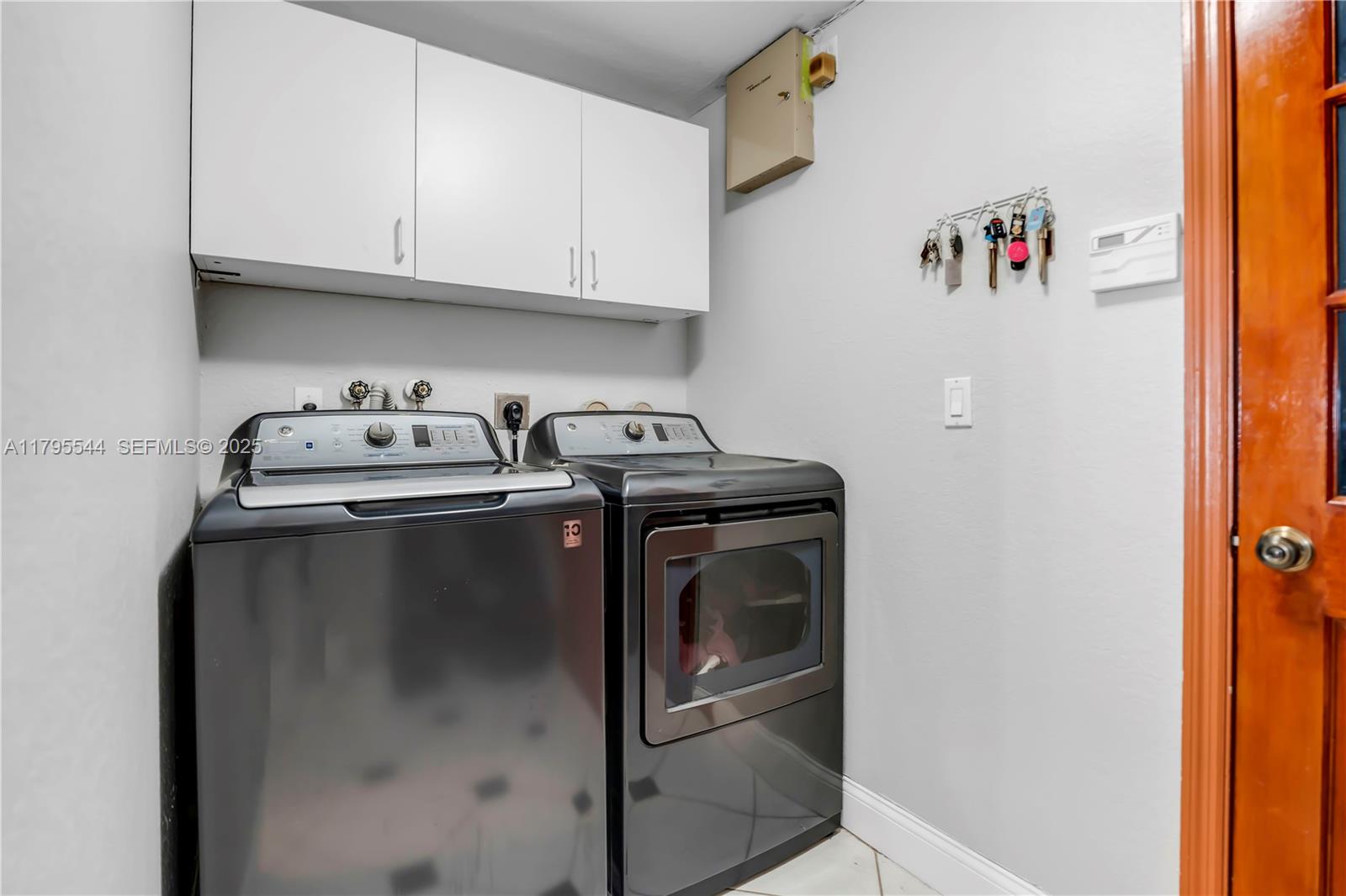 15862 Southwest 24th Street Miramar, FL 33027 - Photo 43 of 61 a utility room with dryer and washer