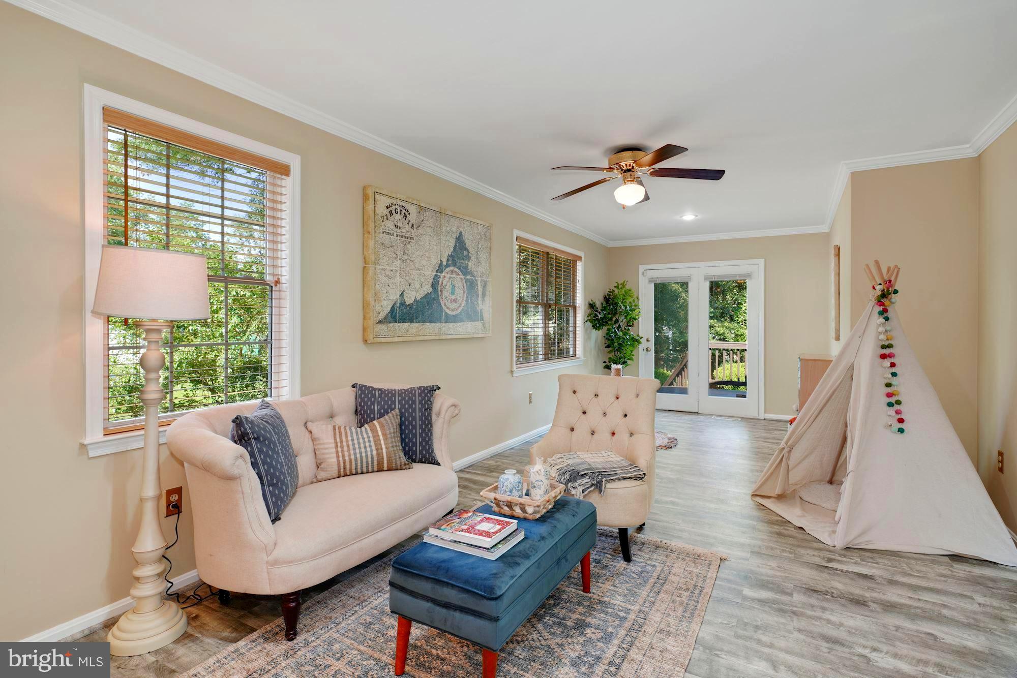 8703 Highgate Road Alexandria, VA 22308 - Photo 14 of 40 23 feet of spacious living area with door to deck