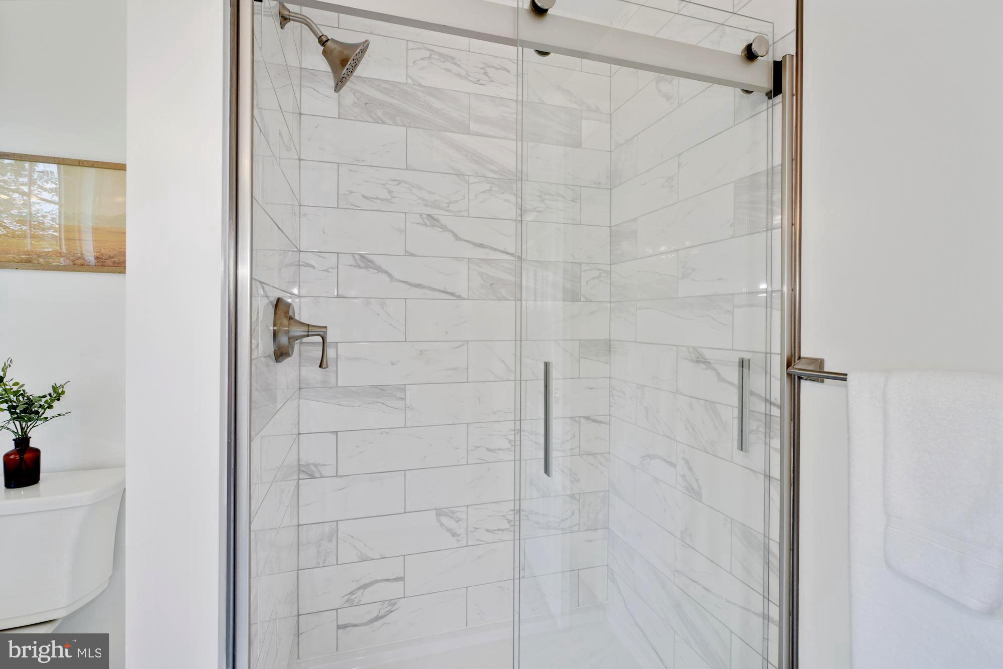 8703 Highgate Road Alexandria, VA 22308 - Photo 18 of 40 Lovely tiled shower in 1st primary suite