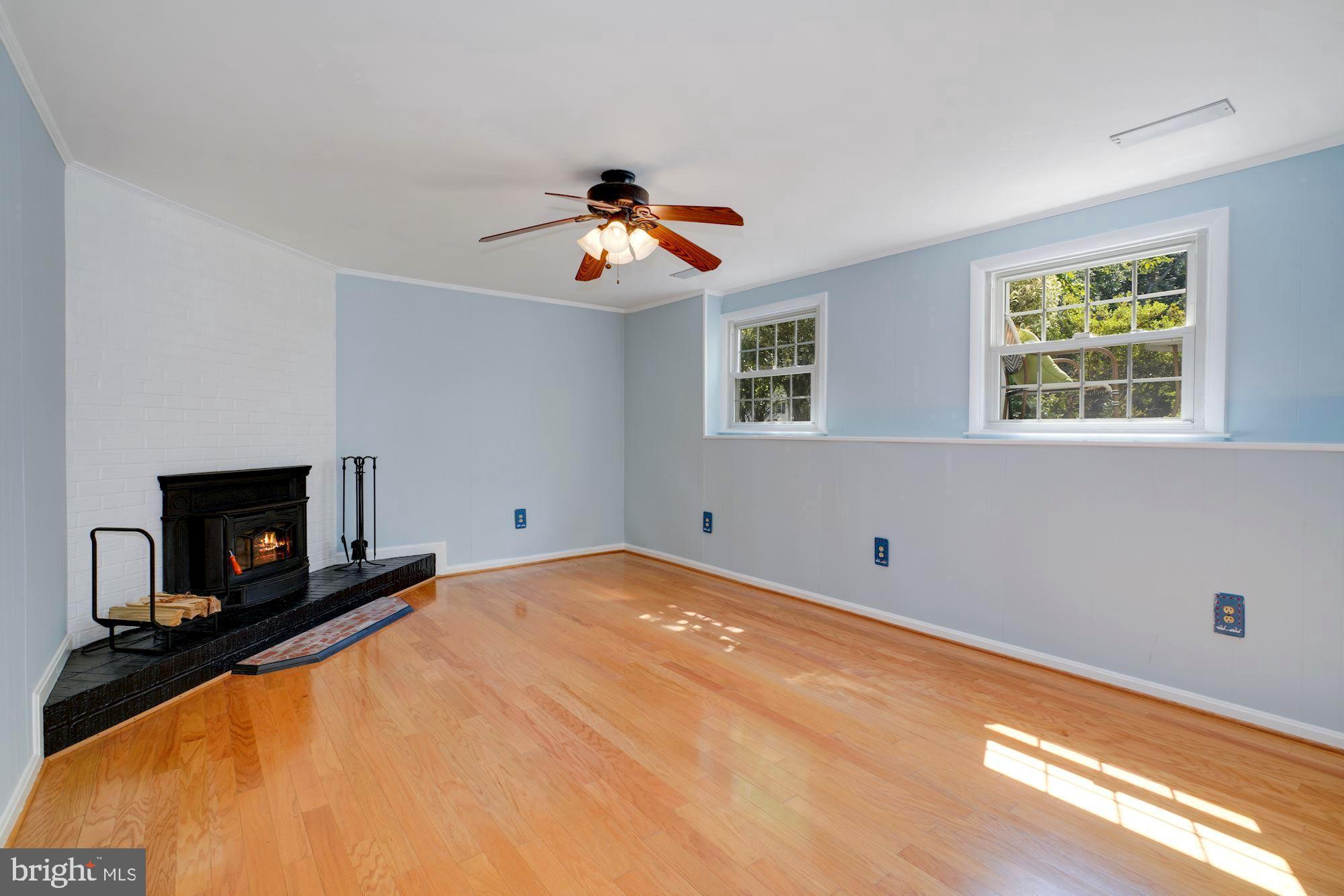 8703 Highgate Road Alexandria, VA 22308 - Photo 26 of 40 Lower level family room with fireplace