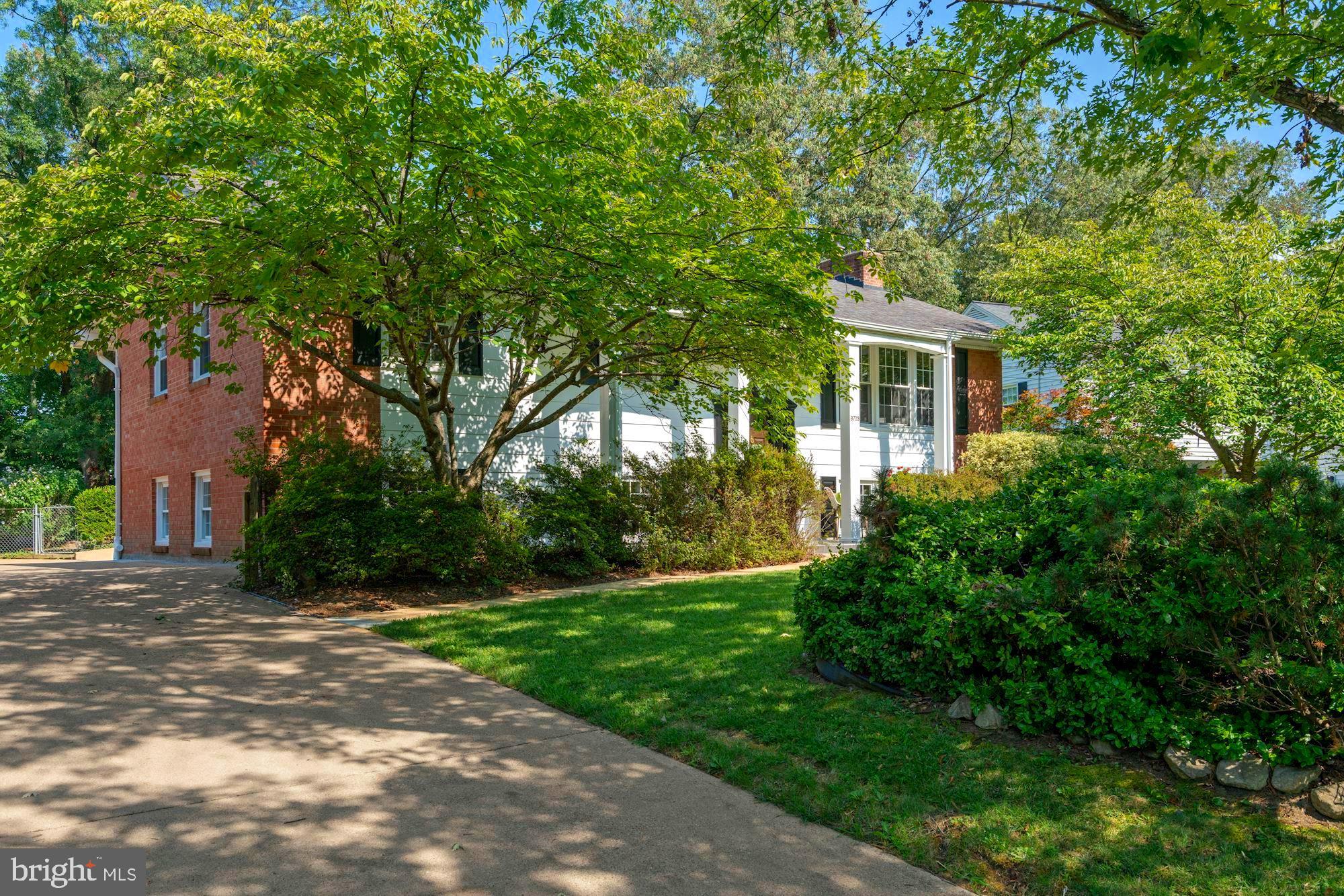 8703 Highgate Road Alexandria, VA 22308 - Photo 4 of 40 Side walk to the front door, drive leads to garage