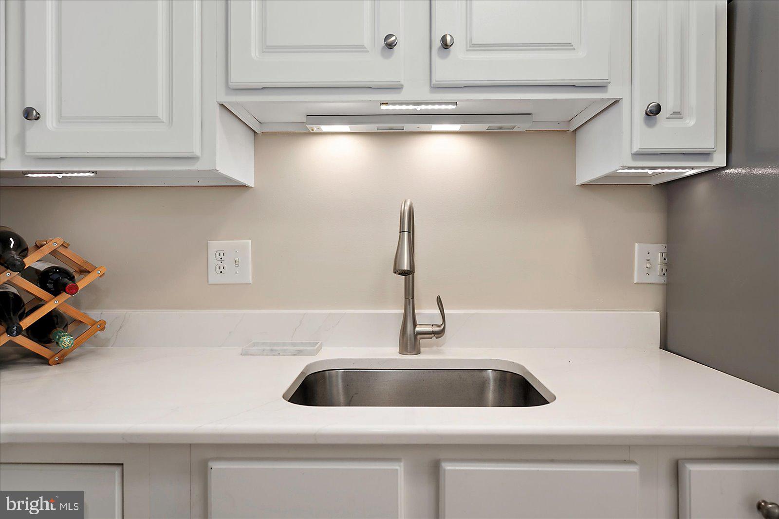 712 Bradley Road, Unit E Ocean City, MD 21842 - Photo 16 of 48 a close view of sink and tap