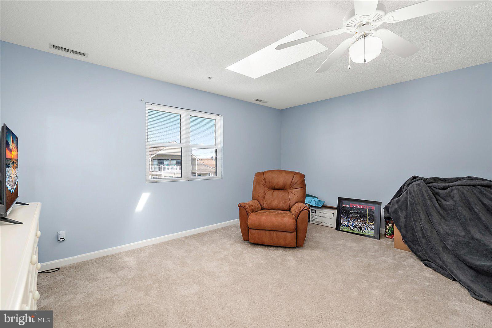 712 Bradley Road, Unit E Ocean City, MD 21842 - Photo 30 of 48 a room with furniture and window