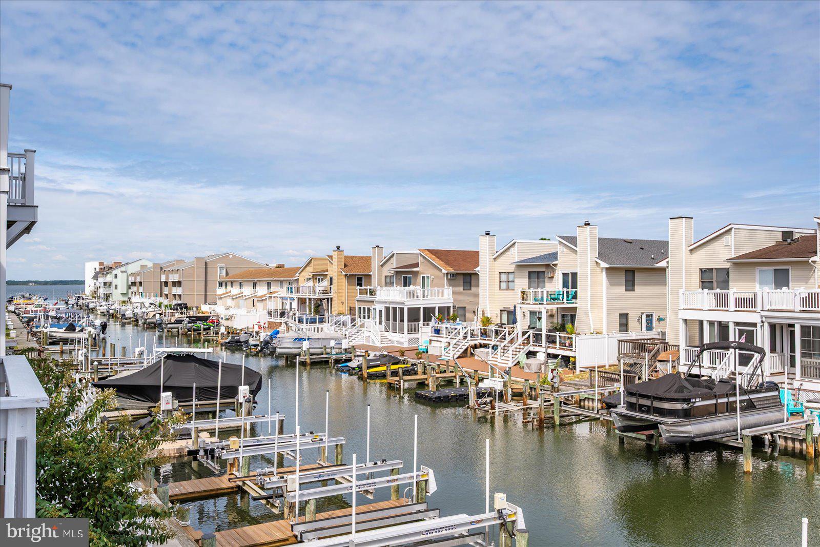 712 Bradley Road, Unit E Ocean City, MD 21842 - Photo 3 of 48 a view of a lake with building in front of it
