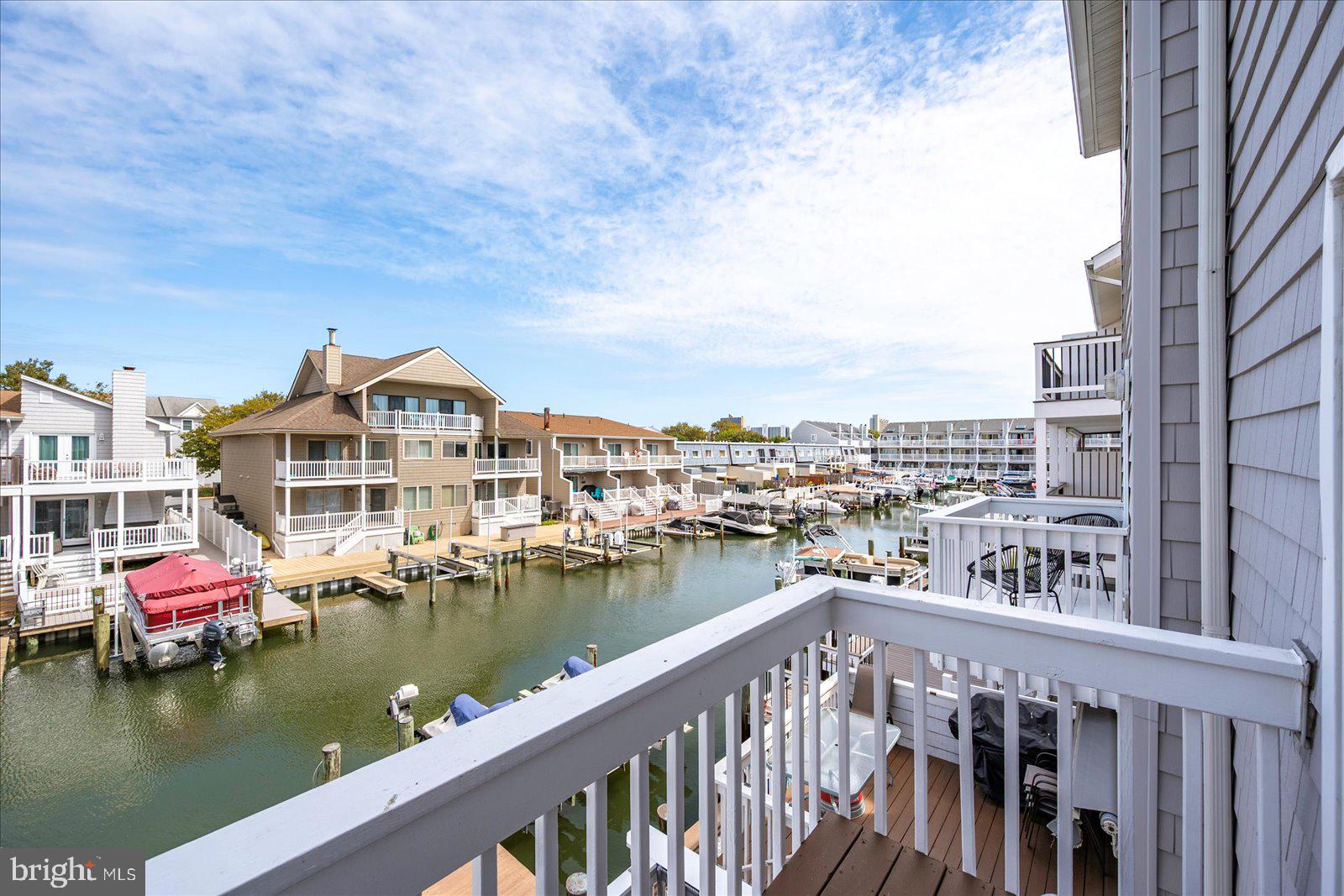 712 Bradley Road, Unit E Ocean City, MD 21842 - Photo 35 of 48 a view of a lake with a city skyline in the background