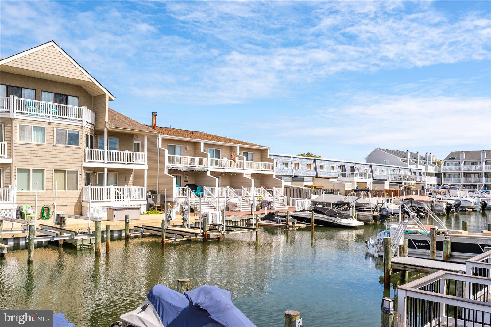 712 Bradley Road, Unit E Ocean City, MD 21842 - Photo 38 of 48 a view of a lake with building