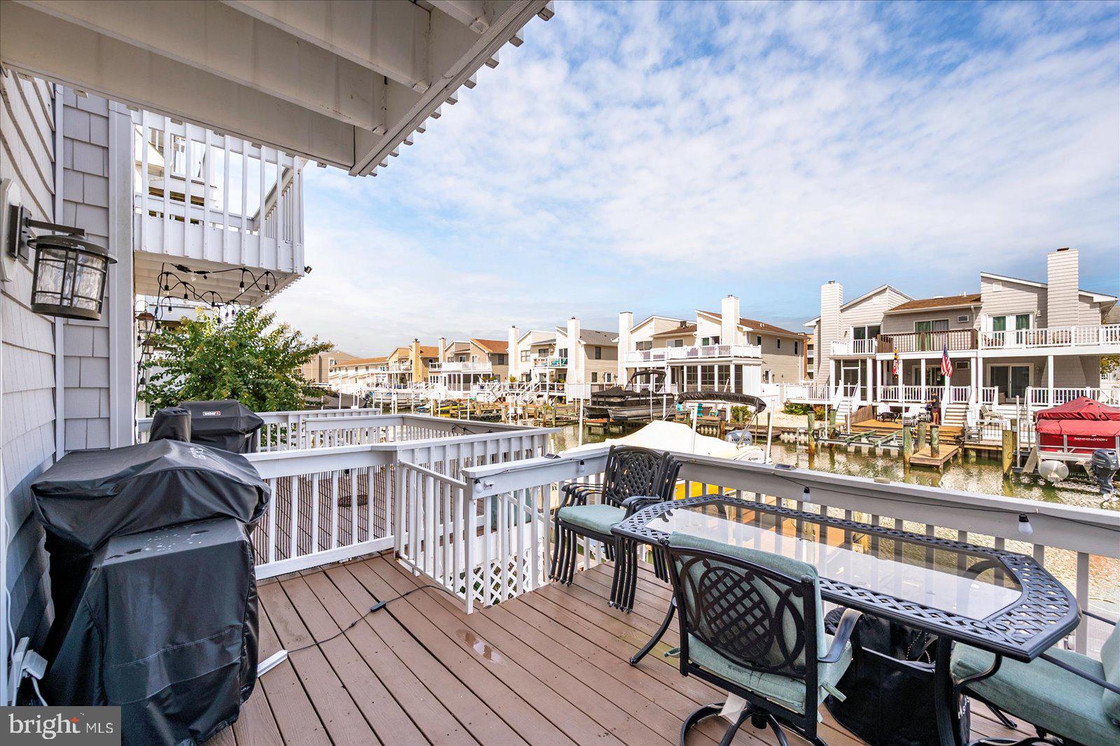 712 Bradley Road, Unit E Ocean City, MD 21842 - Photo 39 of 48 a view of a balcony with furniture