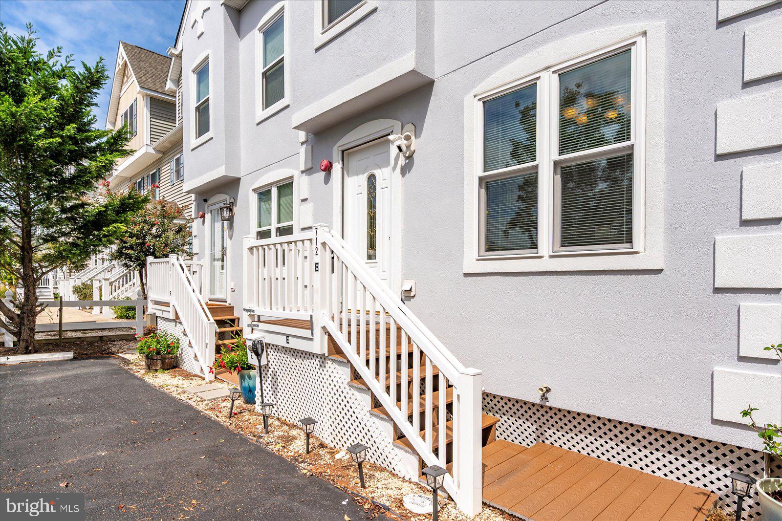 712 Bradley Road, Unit E Ocean City, MD 21842 - Photo 4 of 48 a view of a building with a bench