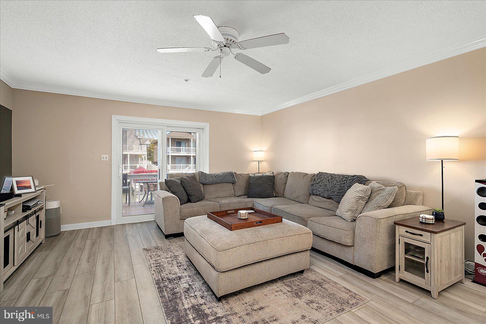 712 Bradley Road, Unit E Ocean City, MD 21842 - Photo 6 of 48 a living room with furniture and a wooden floor