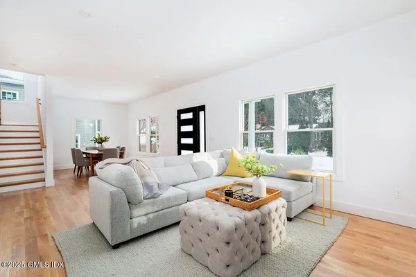 a living room with furniture and a window