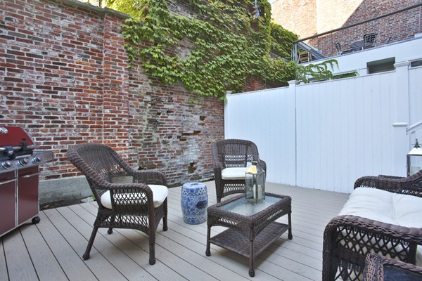 9 Fayette Street, Unit 1 Boston, MA 02116 - Photo 4 of 6 a couple of chairs sitting in backyard of house