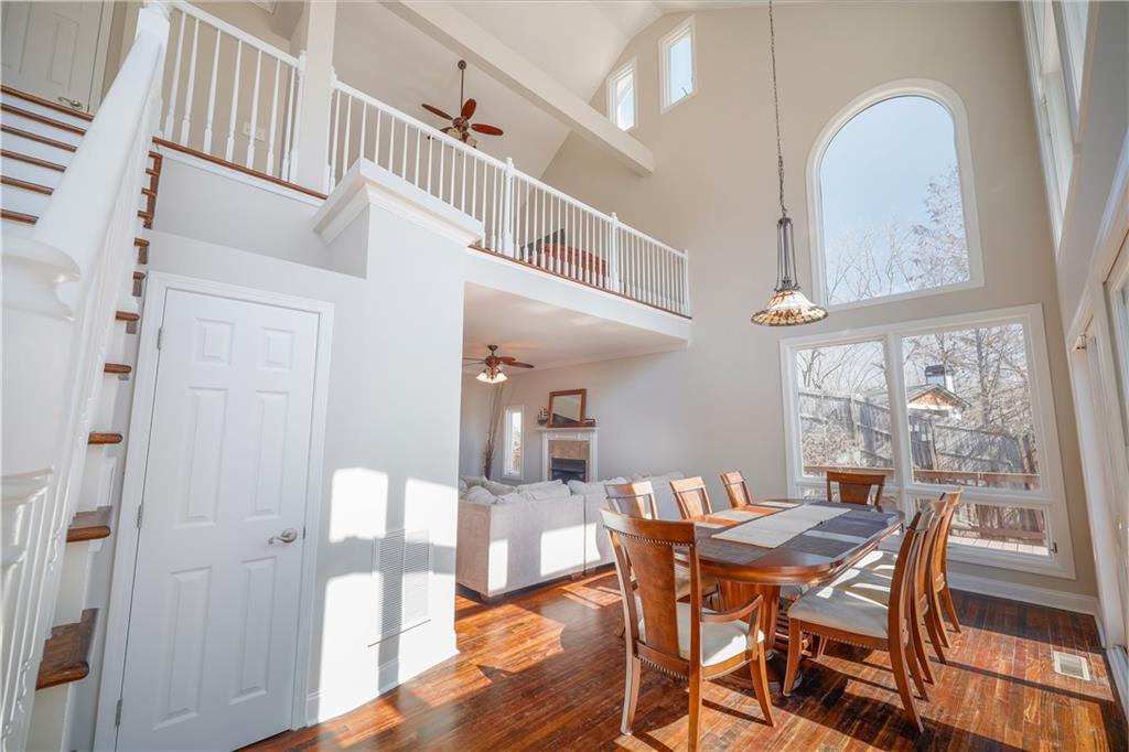 5997 Warpath Road Flowery Branch, GA 30542 - Photo 25 of 76 a view of a dining room with furniture window and wooden floor