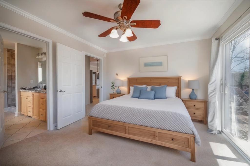 5997 Warpath Road Flowery Branch, GA 30542 - Photo 27 of 76 a bedroom with a bed and a chandelier