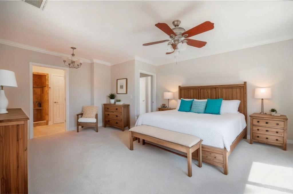 5997 Warpath Road Flowery Branch, GA 30542 - Photo 34 of 76 a bedroom with a bed and a ceiling fan