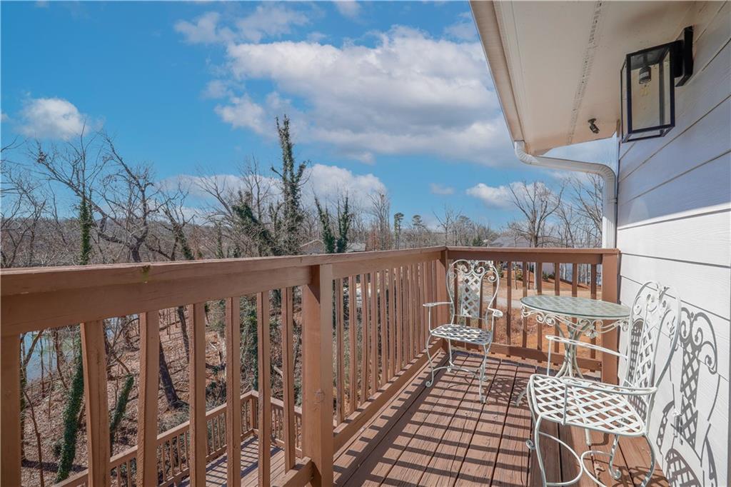 5997 Warpath Road Flowery Branch, GA 30542 - Photo 40 of 76 a view of a balcony with wooden fence