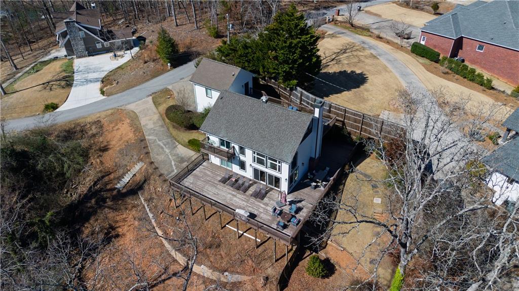 5997 Warpath Road Flowery Branch, GA 30542 - Photo 72 of 76 an aerial view of a house with a yard
