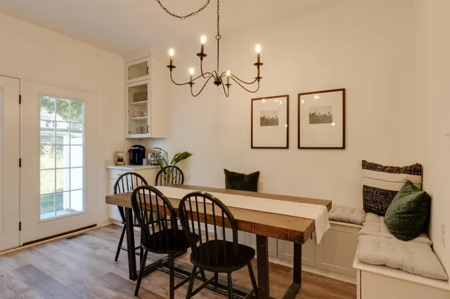 a view of a dining room with furniture window and wooden floor