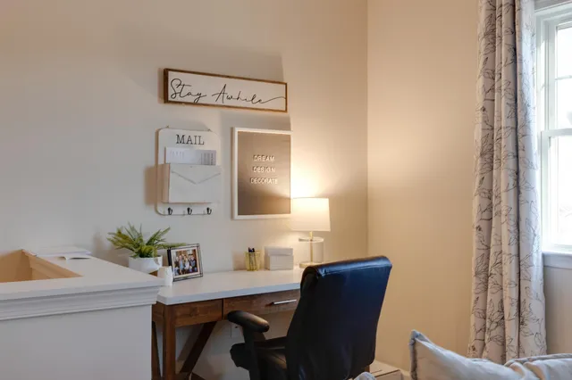 a workspace with furniture and window