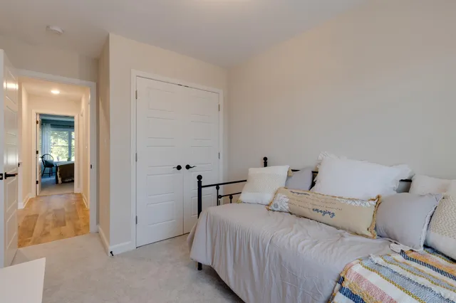 a bedroom with a bed and closet