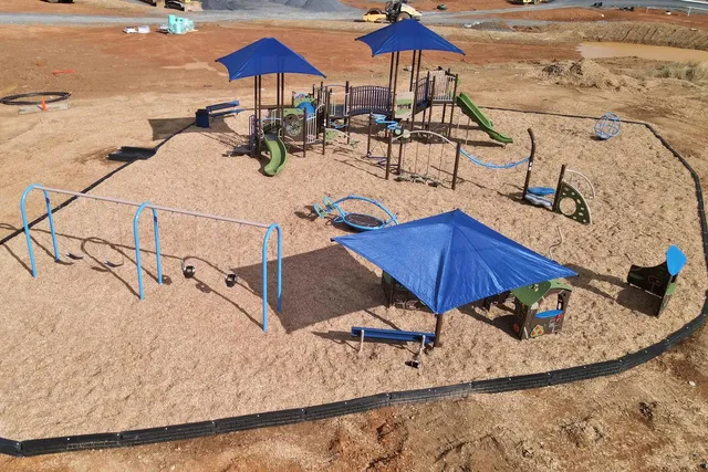 swimming pool view with a seating space