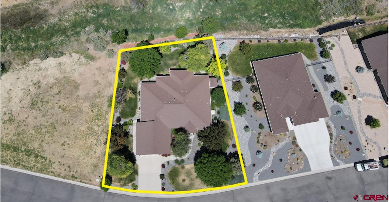 850 Southeast Pinyon Street Cedaredge, CO 81413 - Photo 37 of 45 an aerial view of a house with a swimming pool