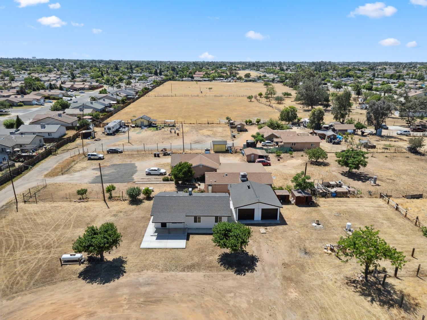 27747 Echo Road Madera, CA 93638 - Photo 33 of 38 an aerial view of a house with a lake view
