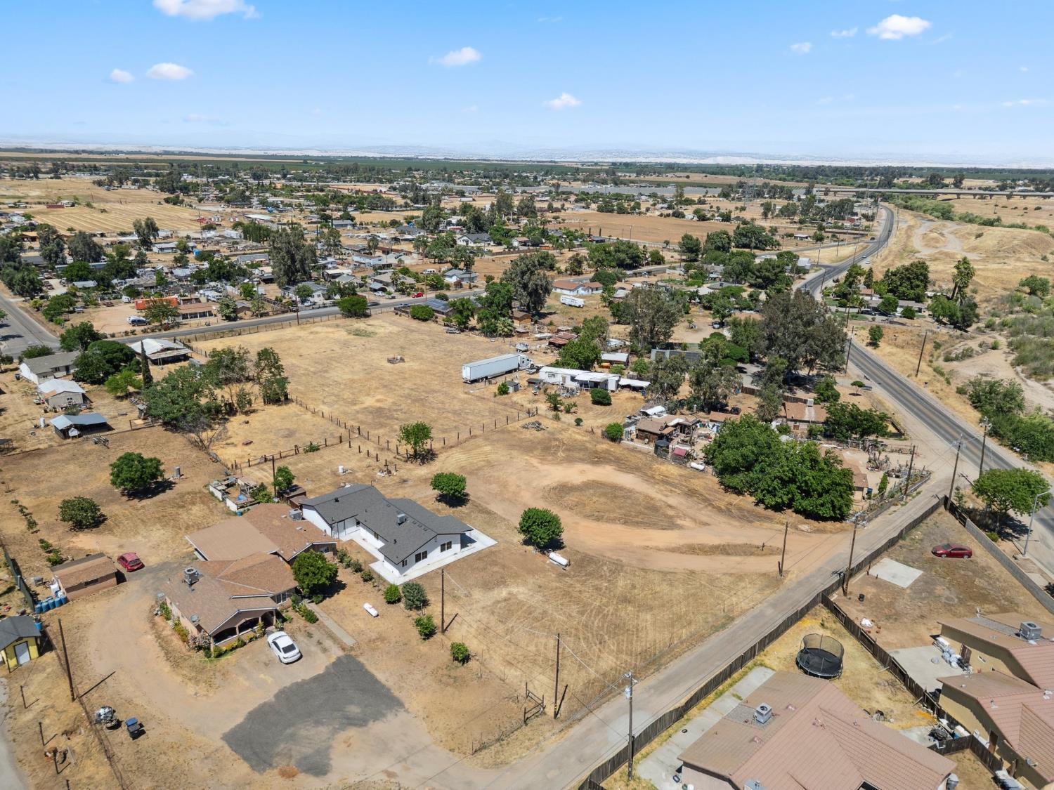 27747 Echo Road Madera, CA 93638 - Photo 37 of 38 an aerial view of residential houses with outdoor space