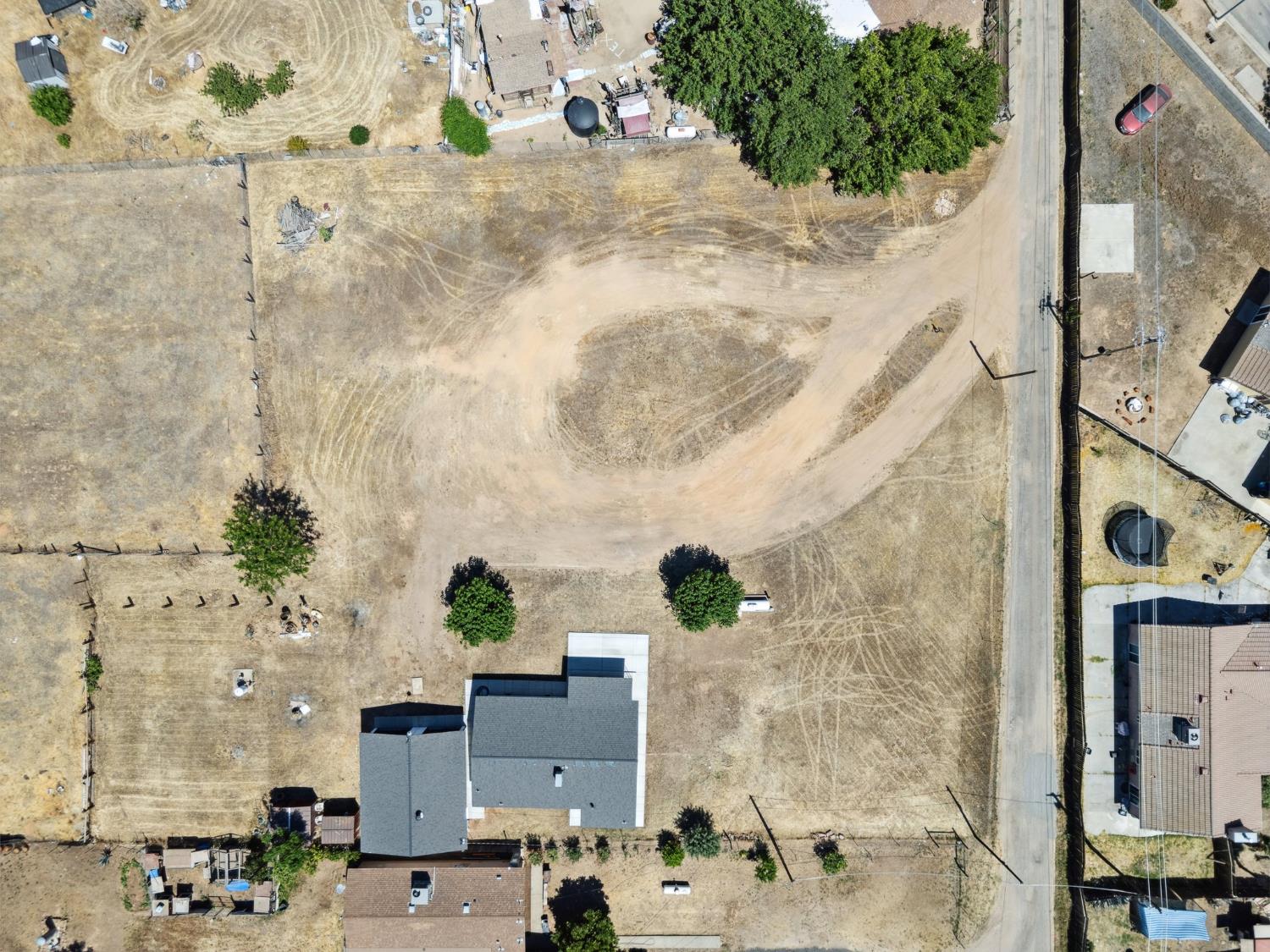 27747 Echo Road Madera, CA 93638 - Photo 38 of 38 an aerial view of residential houses with outdoor space